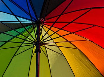 Under colourful umbrella
