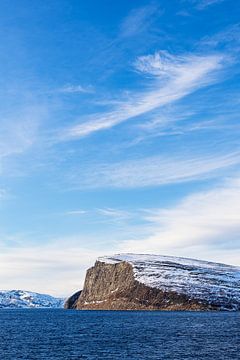 Mountains and rocks in winter near Hammerfest in Norway by Rico Ködder