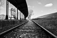 Abandoned train tracks along platform