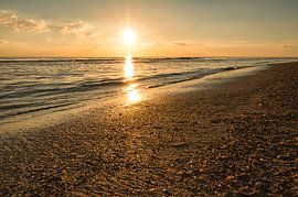 On the beach of Blåvand at sunset by the sea by Martin Köbsch