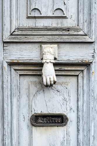 Old wooden front door in a French village by Evert Jan Luchies