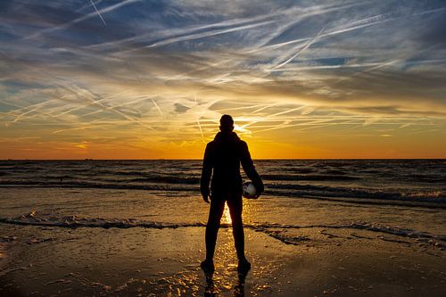 Soccer player by the sea