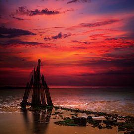 Sculpture of wreckage in the sea.