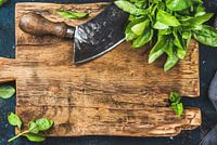 12091585 Fresh basil on a rustic wooden chopping board
