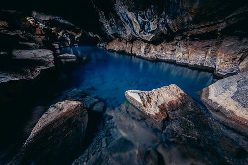 Water source in lava cave Grjotagjá (Iceland)