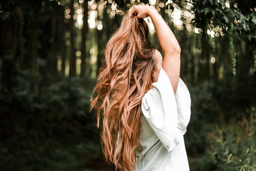 A womans hair dances in the wind with freedom