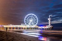 Silhouette in front of Pier of Scheveningen Beach at night