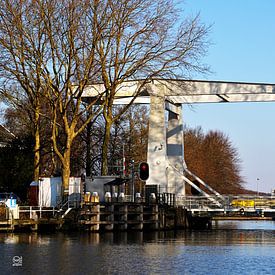 Drawbridge over moat in the Netherlands. by Sailographic Paula