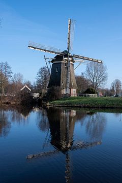 Old mill in Amsterdam van Peter Bartelings