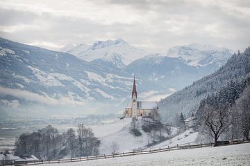 Church in alpine Zillertal valley in winter by iPics Photography