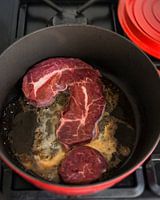 A meat question mark in the pan
