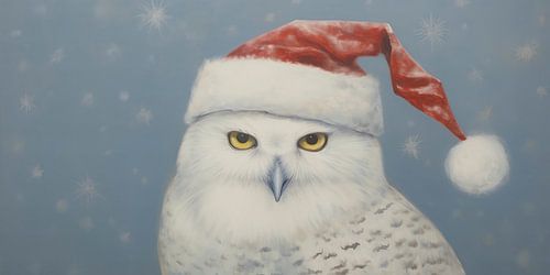 Hibou des neiges portant un chapeau de Père Noël