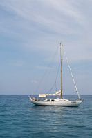 White Boat on Sardinia's Blue Sea
