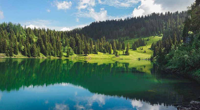 Reflection in mountain lake by mirrorlessphotographer