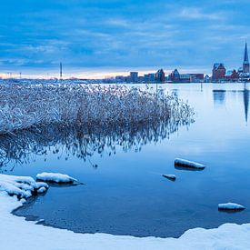 View across the Warnow to the Hanseatic City of Rostock in winter by Rico Ködder
