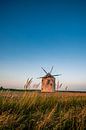 Stone windmill in Hungary Tez, at Lake Balaton. It stands lonely in the field by Fotos by Jan Wehnert thumbnail