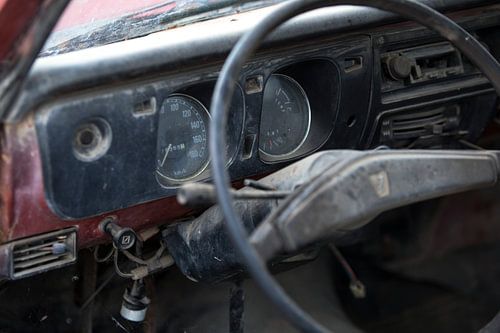 The dashboard of an abandoned oldtimer Mazda