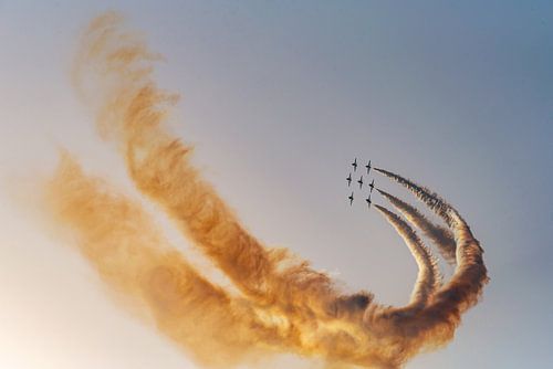 Air show with flying squadron and smoke effect in the sky