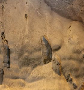 Gnomes and trolls on a cave wall.