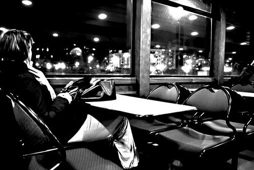 At night on a ferry, alone and lonely.