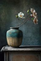 Stileven on a wooden cabinet with flowers