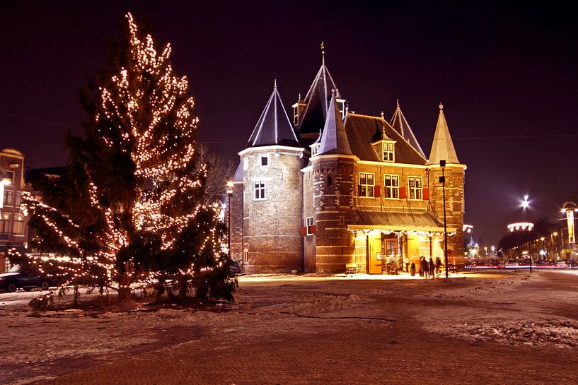 The Waag building in Amsterdam at night during the Christmas period by Eye on You