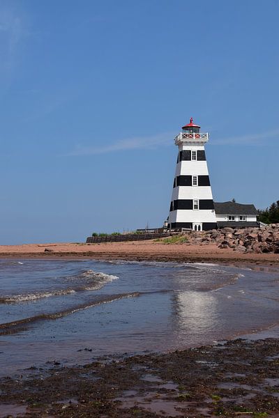 A lighthouse by the sea by Claude Laprise
