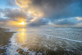 The sun almost setting on a beautiful sky. by Guido Graas