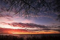 Setting sun above a lake