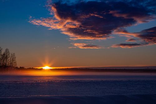 Winter sun over the ice - sunset near Luleå