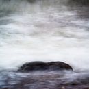 Atmosphere photo of rock in sea by Mark Scheper thumbnail