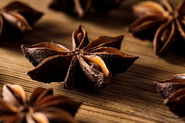 Star anise on wood by Mister Moret
