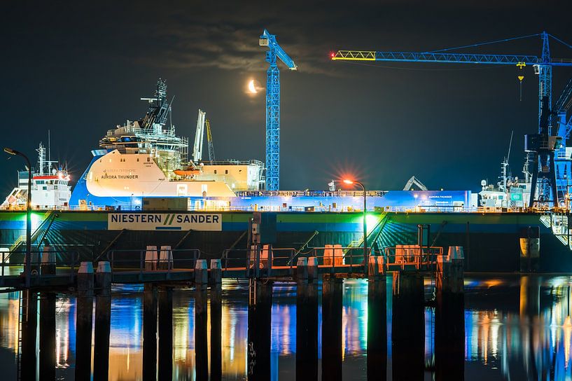 Aurora Thunder in dock at night with moon by Jan Georg Meijer
