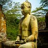 Buddha statue seated around stupa of The Polonnaruwa Vatadage van Inez Wijker