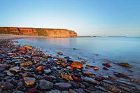 Beach on Helgoland in morning light, water movement