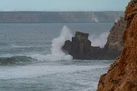 Waves smash on cliff