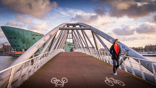 Walker on the connecting bridge in front of Nemo science museum in Amsterdam