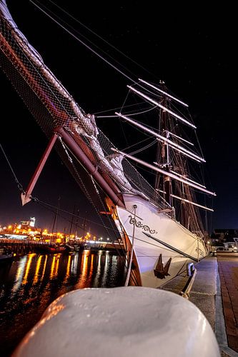 Historic sailing ship in the port of Harlingen on the quay