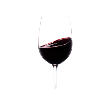 Rode wijn draait in een glas van Thomas Heitz