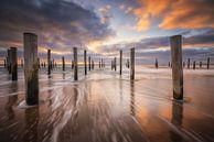 Sunset on the beach near Petten. Beautiful clouds pass by with the cold northern wind while the wave by Bas Meelker thumbnail