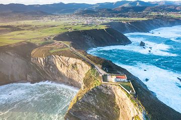 Lighthouse on top the rugged coastline! by Peter Haastrecht, van