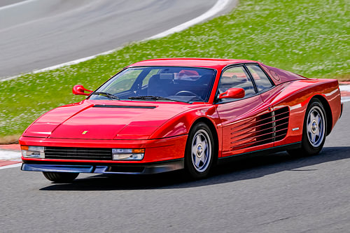 Ferrari Testarossa 1980s sports car driving fast at Spa