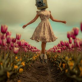 A woman with a camera head floating amongst tulips by But First Framing