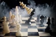 chess queen beats king between other pieces on the chessboard, much smoke over the battle,  against  by Maren Winter thumbnail