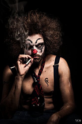 Sternly looking clown with cigaret