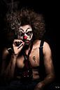 Sternly looking clown with cigaret by Atelier Liesjes thumbnail