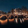 Amsterdam bij nacht van Daniel Ritzrow