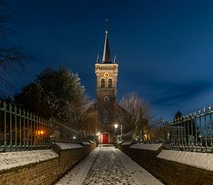 Elsloo in de avond in de winter met sneeuw