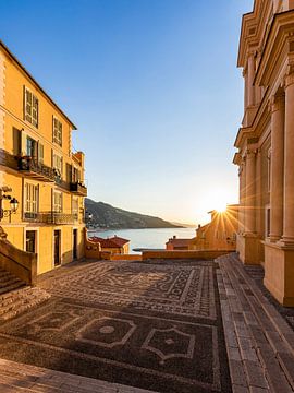 Sunrise on the church square in Menton, France by Werner Dieterich