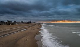 Dark clouds above Scheveningen beach by Michiel van den Bos